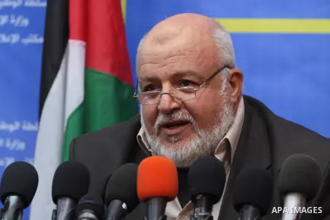 Palestinian undersecretary of the Ministry of Social Affairs in Gaza Strip Omar al-Dardi, speaks during a press conference in Gaza City on December 15, 2013. Rescue workers evacuated more than 5,000 Gaza Strip residents...