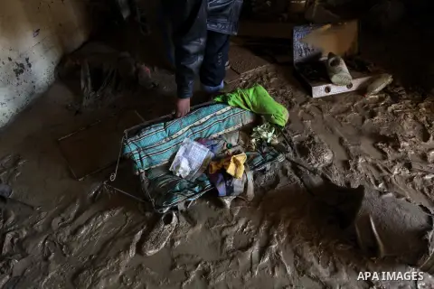 A Palestinian man inspects his house after flooded during four days of storms in Deir al-Balah in central Gaza Strip, December 17, 2013. A fierce winter storm shut down much of the Middle East last week leaving people to...