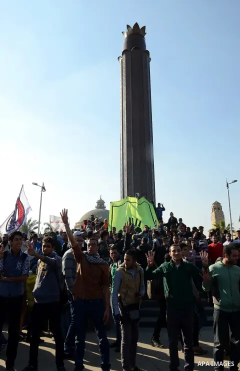 Cairo University students, who are supporters of the Muslim Brotherhood and ousted Egyptian President Mohamed Mursi, shout slogans during a march against Egypt's new military rulers, outside Cairo University in Cairo on...