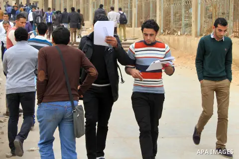 Egyptian students return to study at the Al-Azhar University in Cairo on January 4, 2014. On January 3, 2014, at least 13 people died in clashes across Egypt as police dispersed thousands of protesters demanding the rein...
