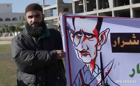 Palestinians take part in a solidarity with Palestinian children at Yarmouk refugee camp in Syria in Gaza city on January 8, 2014. The Syrian army has besieged the Yarmouk Palestinian camp for a year as battles rage insi...