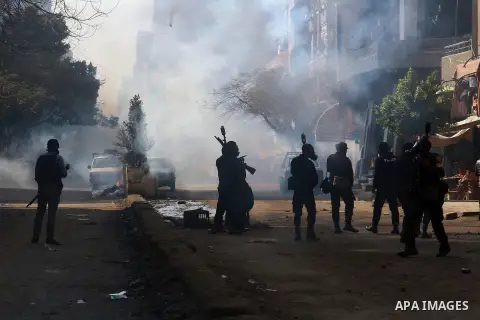 Egyptian security forces clash with supporters of ousted President Mohamed Morsi in the El-Omraneya neighborhood in Cairo, Egypt, Friday Jan. 10, 2014. Hundreds of Islamists rallied in Egypt s capital and across the coun...