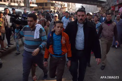 Egyptian security forces detain a supporter of the Muslim Brotherhood and ousted Egyptian President Mohamed Mursi, in the El-Omraneya neighborhood in Cairo, Egypt, Friday Jan. 10, 2014. Hundreds of Islamists rallied in E...