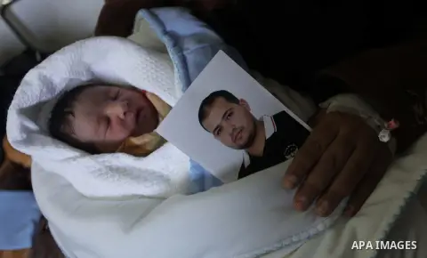 Palestinian mother Hanaa al-Zanen, 26, holds her new born baby boy, who was conceived with sperm from her husband smuggled out of an Israeli prison, at a hospital in Gaza City on January 11, 2013. The boy is the son of P...