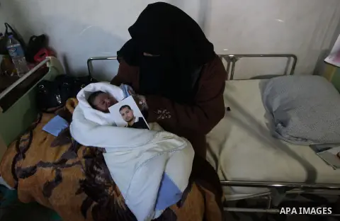 Palestinian mother Hanaa al-Zanen, 26, holds her new born baby boy, who was conceived with sperm from her husband smuggled out of an Israeli prison, at a hospital in Gaza City on January 11, 2013. The boy is the son of P...