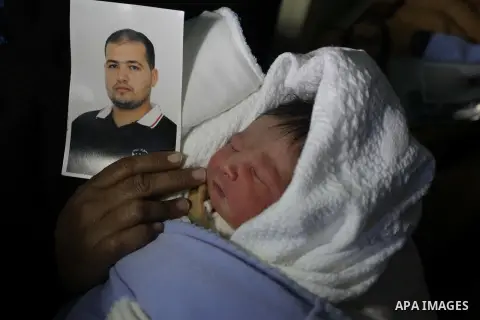 Palestinian mother Hanaa al-Zanen, 26, holds her new born baby boy, who was conceived with sperm from her husband smuggled out of an Israeli prison, at a hospital in Gaza City on January 11, 2013. The boy is the son of P...