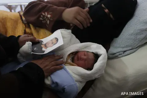 Palestinian mother Hanaa al-Zanen, 26, holds her new born baby boy, who was conceived with sperm from her husband smuggled out of an Israeli prison, at a hospital in Gaza City on January 11, 2013. The boy is the son of P...