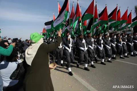 Palestinian security forces show their skills during a military parade in Gaza city on January 13, 2014, marking the fifth anniversary of the three-week Israeli offensive on the Gaza Strip in which more than a thousand P...