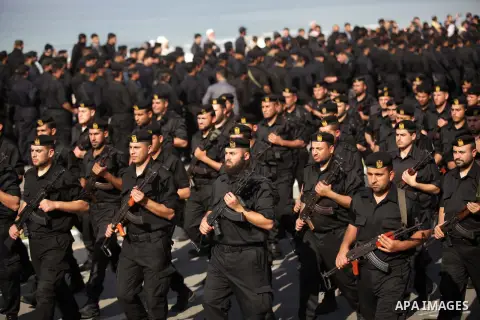 Palestinian security forces show their skills during a military parade in Gaza city on January 13, 2014, marking the fifth anniversary of the three-week Israeli offensive on the Gaza Strip in which more than a thousand P...