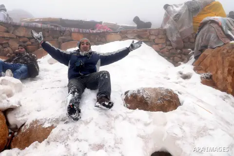 Egyptians play with snow covers Saint Catherine, south Sinai on January 13, 2014. Photo by Mohammed Bendari