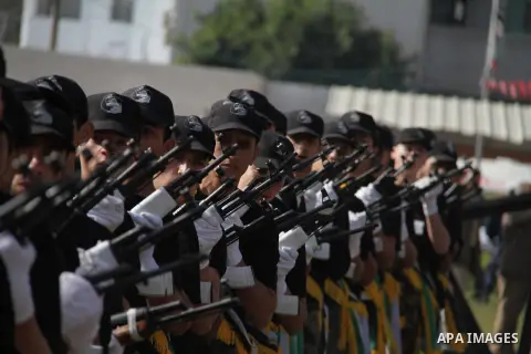 Palestinian high school students take part in a graduation ceremony in Gaza city January 14, 2014. Photo by Ashraf Amra