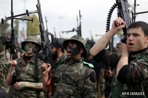 Palestinian students take part in a graduation ceremony for a military-style training programme in Gaza City on January 14, 2014. Some 13,000 students joined the course, which is aimed at preparing them for "liberating P...