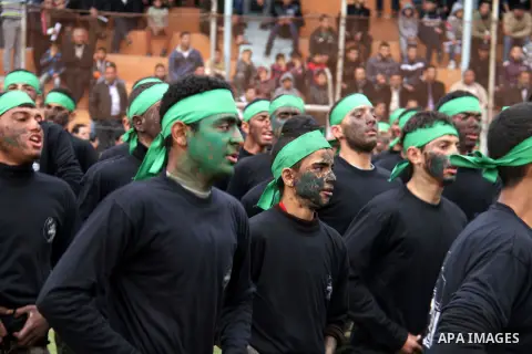 Palestinian students take part in a graduation ceremony for a military-style training programme in Gaza City on January 14, 2014. Some 13,000 students joined the course, which is aimed at preparing them for "liberating P...