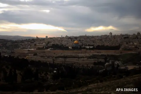 The Dome of the Rock mosque is seen during the sunset, in Jerusalem's Old City on January 14, 2014. Photo by Saeed Qaq