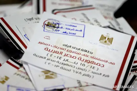 Ballots are seen at a polling station in the Egyptian capital Cairo on January 15, 2014 during the ballot counting at the end of the second day of voting in a referendum on a new constitution. Voting proceeded smoothly i...