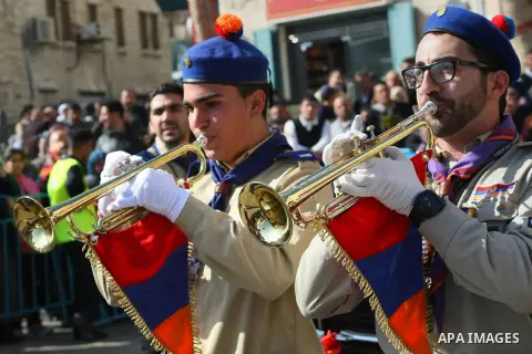 Palestinian scouts play musical instruments during a celebrate outside the Nativity Church in the biblical West Bank city of Bethlehem on January 18, 2014. While most Armenians celebrate Christmas on January 6th, the Ort...