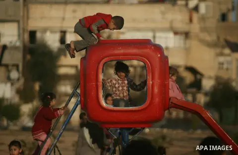 Palestinian children play outside their house in Al Sultan refugee camp in Rafah, southern of Gaza Strip on, 18 Jan, 2014. Photo by Eyad Al Baba