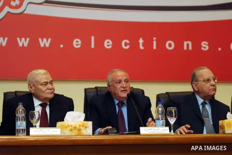 Nabil Salib, head of the Supreme Election Committee, holds a news conference announcing a new constitution in Cairo January 18, 2014. More than 98 percent of voters backed the new Egyptian constitution in a referendum th...