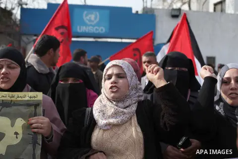Supporters of the Democratic Front for the Liberation of Palestine take part in a protest to show solidarity with Palestinian refugees in Syria's main refugee camp Yarmouk, in front of the headquarters United Nations (UN...