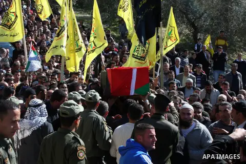 Palestinians carry the coffin of Majdi Khanfar, a Palestinian militant who was reportedly killed by Israeli forces during fighting ten years ago, during his reburial in the village of Silat al-Zaher near the city of Jeni...