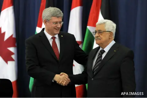 Palestinian President Mahmoud Abbas (R) and Canada's Prime Minister Stephen Harper take part in a joint news conference in the West Bank city of Ramallah January 20, 2014. Harper is on a four-day visit to Israel and the...