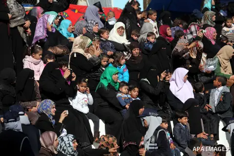 Palestinians attend a graduation ceremony of policemen loyal to Hamas in Gaza City January 29, 2014. Photo by Ashraf Amra