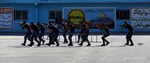 Palestinian policemen loyal to Hamas show their skills during a graduation ceremony in Gaza City January 29, 2014 Photo by Ashraf Amra