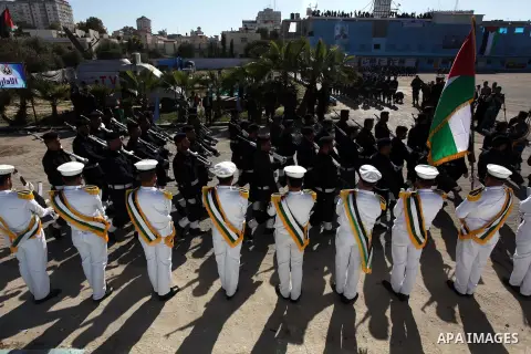 Palestinian policemen loyal to Hamas march during a graduation ceremony in Gaza City January 29, 2014. Photo by Ashraf Amra
