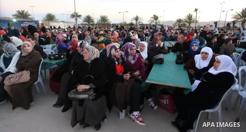Palestinians take part in a mass wedding ceremony attended by Palestinian Authority President Mahmud Abbas (unseen) in the West bank city of Jericho on January 28, 2014. Nearly 300 Palestinians were married in the West B...