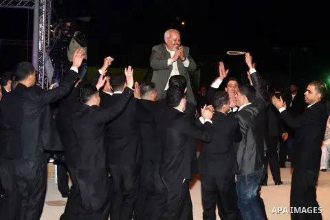 Palestinian grooms dance during a mass wedding ceremony attended by Palestinian Authority President Mahmud Abbas (unseen) in the West bank city of Jericho. Nearly 300 Palestinians were married in the West Bank and the Ga...