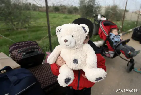 A Palestinian boy waits to cross into Egypt, at the Rafah crossing between Egypt and the southern Gaza Strip on Feb. 04, 2014. Egyptian authorities partially opened the Rafah crossing, Gaza's main window to the world, on...