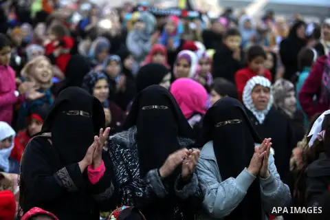 Palestinians attend a mass wedding ceremony in Gaza City on February 04, 2014. Nearly 50 Palestinians were married in the Gaza Strip in a mass wedding funded by the office of Palestinian President Mahmoud Abbas. Photo by...