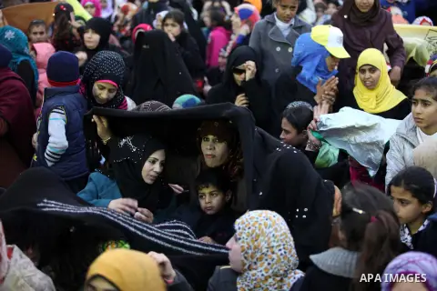 Palestinians attend a mass wedding ceremony in Gaza City on February 04, 2014. Nearly 50 Palestinians were married in the Gaza Strip in a mass wedding funded by the office of Palestinian President Mahmoud Abbas. Photo by...