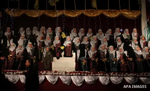 Palestinian brides take part in a mass wedding ceremony in Gaza City on February 04, 2014. Nearly 50 Palestinians were married in the Gaza Strip in a mass wedding funded by the office of Palestinian President Mahmoud Abb...