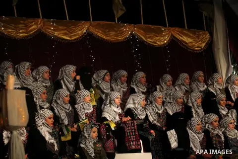 Palestinian brides take part in a mass wedding ceremony in Gaza City on February 04, 2014. Nearly 50 Palestinians were married in the Gaza Strip in a mass wedding funded by the office of Palestinian President Mahmoud Abb...