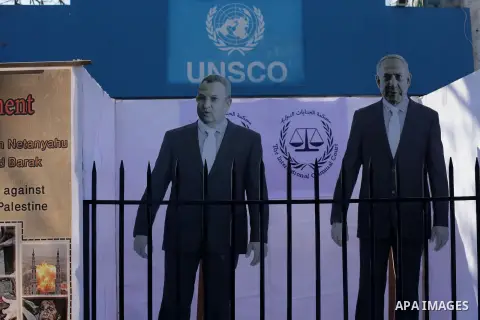 A General show of the images of the war criminals Prime Minister of Israel Benjamin Netanyahu, and former Prime Minister Ehud Barak during a moot court for them, in front of the headquarters of the United States, in Gaza...