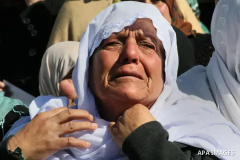 A Palestinian woman mourns during the funeral of Ahmed al-Faqih, in the West Bank village of Dura, southeast of Hebron, Feb. 10, 2014. Israel on Sunday evening delivered the remains of Ahmad Ayid Faqih who was killed in...