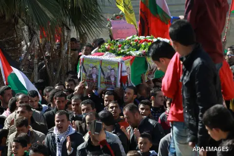 Palestinians carry the coffin of Habash Hanani, killed in 2002, during his funeral in the West Bank city of Nablus. Wednesday, Feb. 12, 2014. Israel started transferring the bodies of 36 Palestinians killed in attacks on...