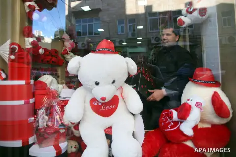 A Palestinian vendor displays gift at his store ahead of Valentine's day in Jerusalem on February 13, 2014. Valentine's Day is increasingly popular among younger Palestinians, many of whom have taken up the custom of giv...