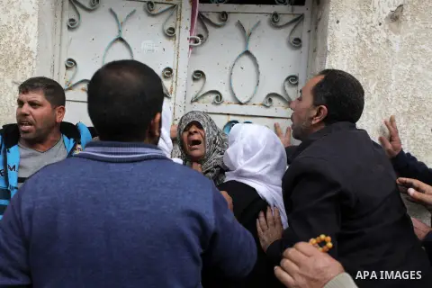 The Palestinian mother of Ibrahim Mansour, 26, who was killed by Israeli soldiers, mourns during his funeral in Gaza City February 14, 2014. Israeli soldiers shot and killed Mansour and wounded another on Thursday in the...