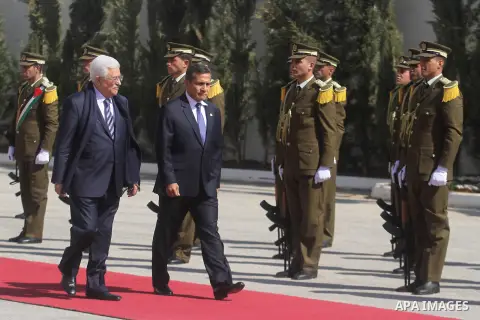 Palestinian President Mahmoud Abbas and his Peruvian counterpart Ollanta Humala walk past an honour guard during a welcoming ceremony in the West Bank city of Ramallah February 18 2014. Peruvian President Ollanta Humala...