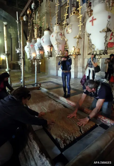 Greek Orthodox worshipers pray at the Church of the Holy Sepulchre, in Jerusalem's Old City, February 19, 2014. Photo by Saeed Qaq
