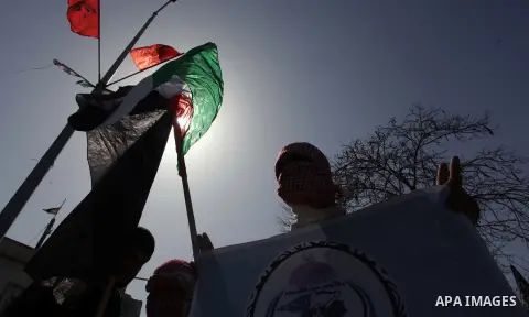 Palestinian supporters of the Popular Resistance Movement take part in a protest in solidarity with Muslims in Central African Republic, in front of the headquarter United Nation "UNSCO" in Gaza city, February 22, 2014....