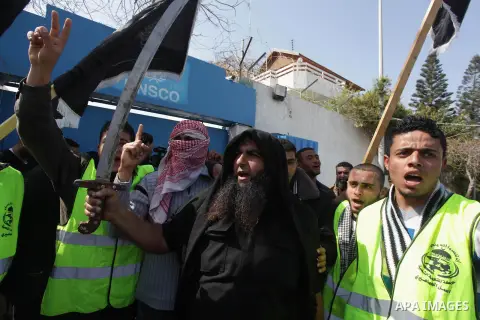A Palestinian supporter of the Popular Resistance Movement holds a sword during a protest in solidarity with Muslims in Central African Republic, in front of the headquarter United Nation "UNSCO" in Gaza city, February 2...
