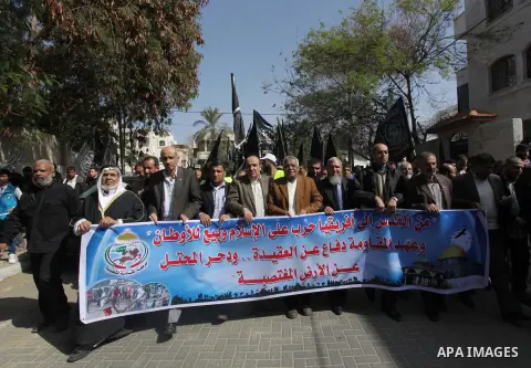 Palestinian supporters of the Popular Resistance Movement take part in a protest in solidarity with Muslims in Central African Republic, in front of the headquarter United Nation "UNSCO" in Gaza city, February 22, 2014....