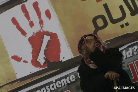 Palestinians gather during a protest in front of the Rafah border crossing with Egypt in the southern Gaza Strip on February 24, 2014, to demand that Egypt lift border crossing restrictions. Egypt imposed the restriction...