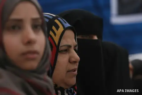 Palestinians gather during a protest in front of the Rafah border crossing with Egypt in the southern Gaza Strip on February 24, 2014, to demand that Egypt lift border crossing restrictions. Egypt imposed the restriction...