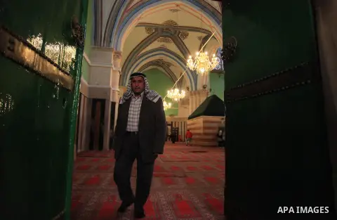 A Palestinian man walks at the Ibrahimi Mosque in the southern West Bank city of Hebron on February 25, 2014. On February 25, 1994, Israeli settler Baruch Goldstein used an assault rifle to gun down worshippers in the Ib...