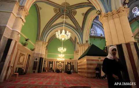Palestinian worshipers visit the Ibrahimi Mosque in the southern West Bank city of Hebron on February 25, 2014. On February 25, 1994, Israeli settler Baruch Goldstein used an assault rifle to gun down worshippers in the...