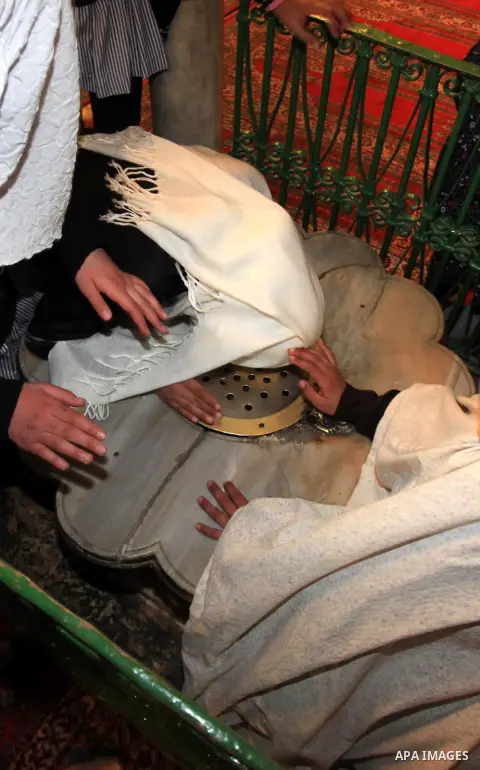 Palestinian girls pray at the Ibrahimi Mosque in the southern West Bank city of Hebron on February 25, 2014. On February 25, 1994, Israeli settler Baruch Goldstein used an assault rifle to gun down worshippers in the Ibr...